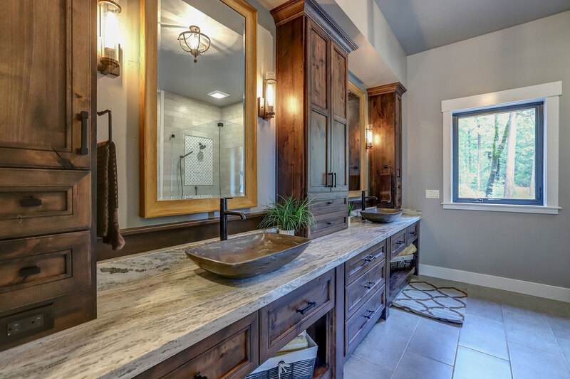 Nevada City, CA New Home Construction Finished Bathroom Vanity Install with bronze stone vessel sinks