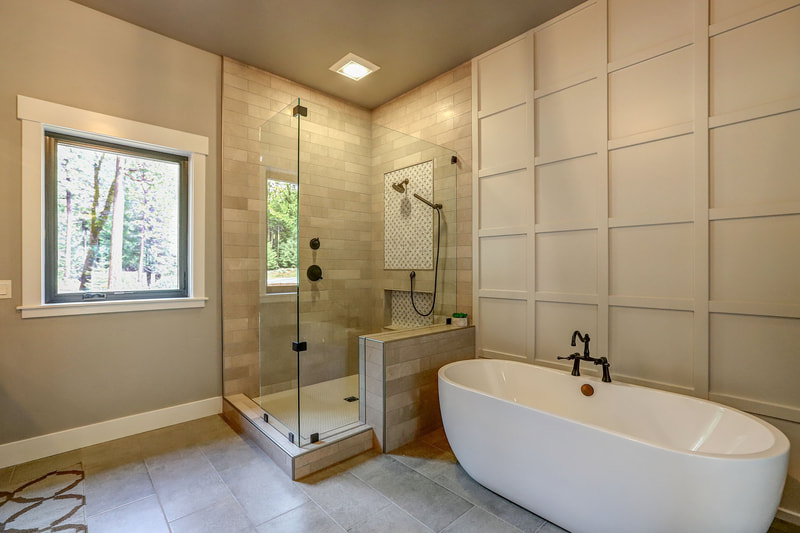 Nevada City, CA New Home Construction Finished Luxury Master Suite Shower and white porcelain stand alone  Bathtub Installation with Bronze Fixtures