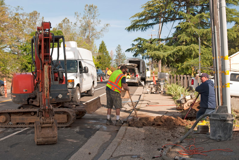 Nevada City, CA Replacing Existing Septic Line and tying into City sewer system. Guys are digging up sidewalk