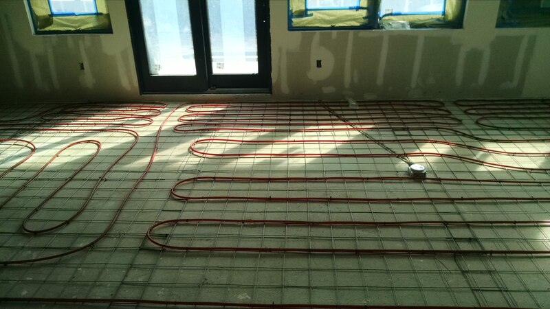 Grass Valley, CA Install Hydronic Heat System with red PEX installed on concrete foundation of home