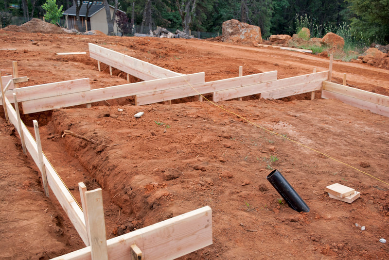 Grass Valley, CA New Home Construction Footings Trenched for foundation, some rough plumbing started