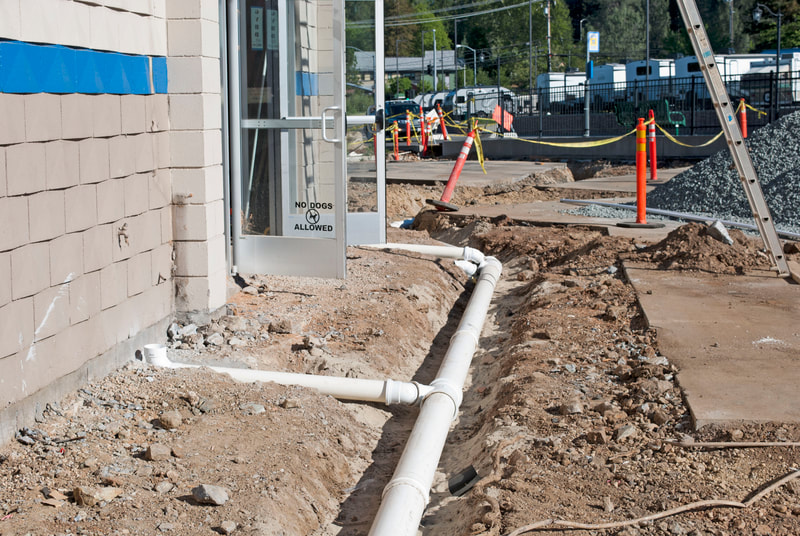 Grass Valley, CA Commercial Remodel Storm Drain Line Install outside of building in trenches